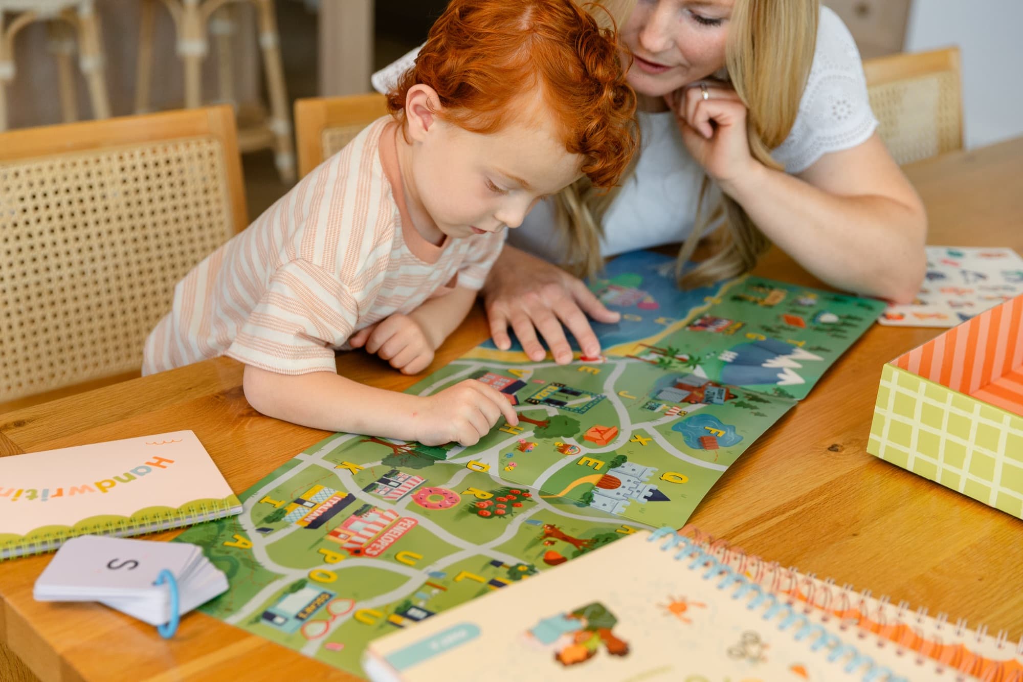 A parent and child using the curriculum together