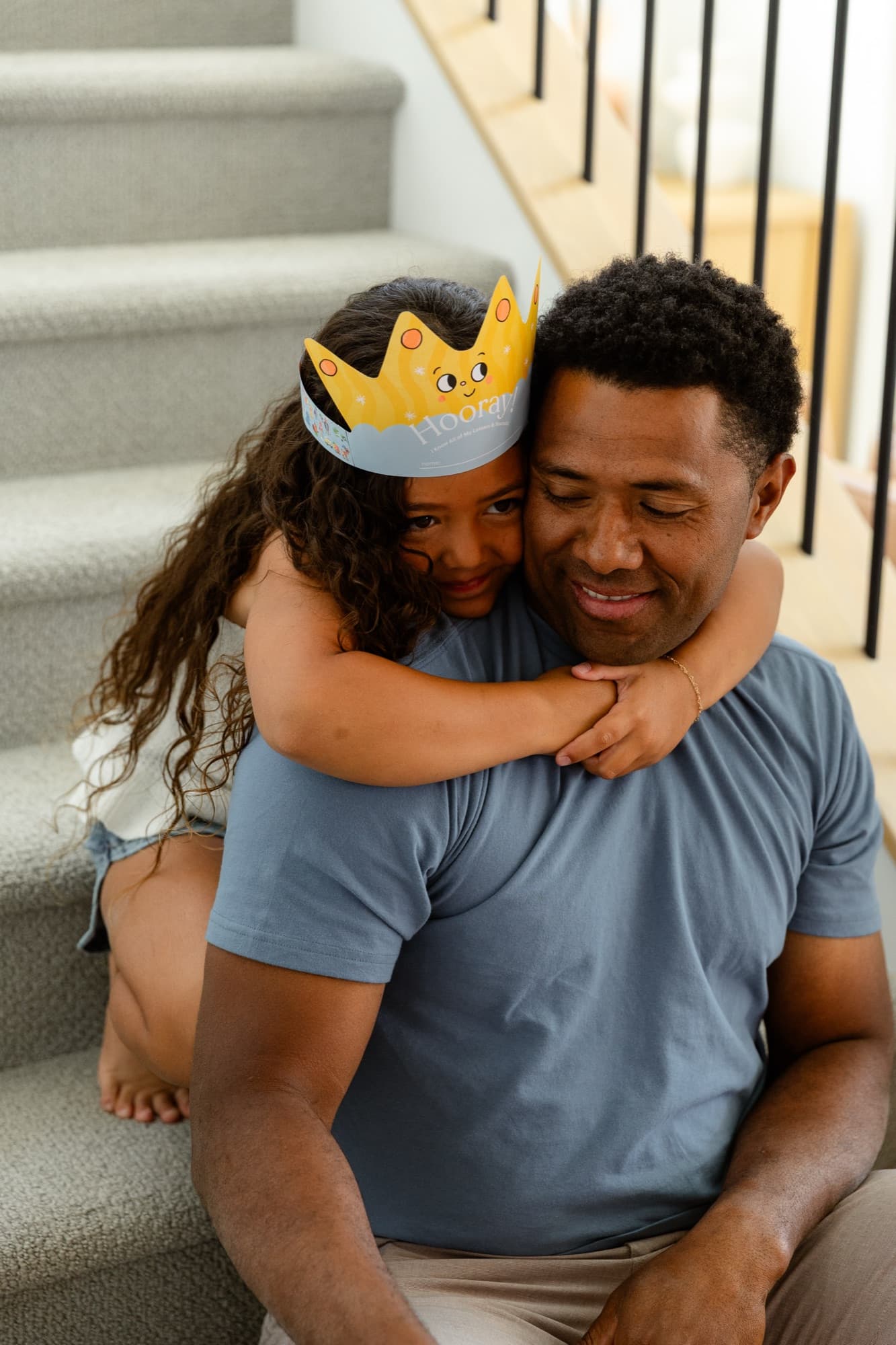 A daughter hugging her dad after finishing a lesson